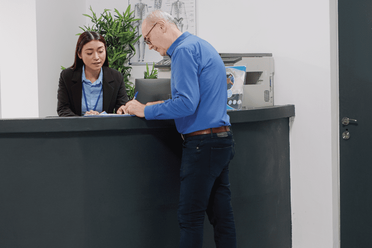 a patient checking-in at an urgent care waiting room