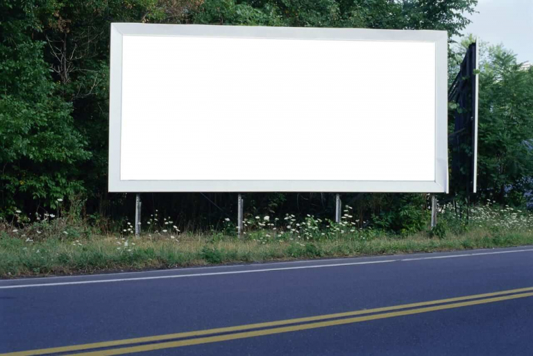 Blank billboard on the side of a highway