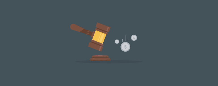 A wooden judge’s gavel strikes a sound block, with coins and dollar symbols in the air, symbolizing financial decisions or legal costs.
