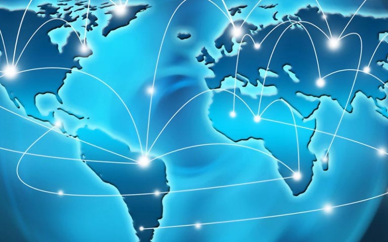 A digital map of the world with white lines and points illustrates global communication and connectivity between continents.