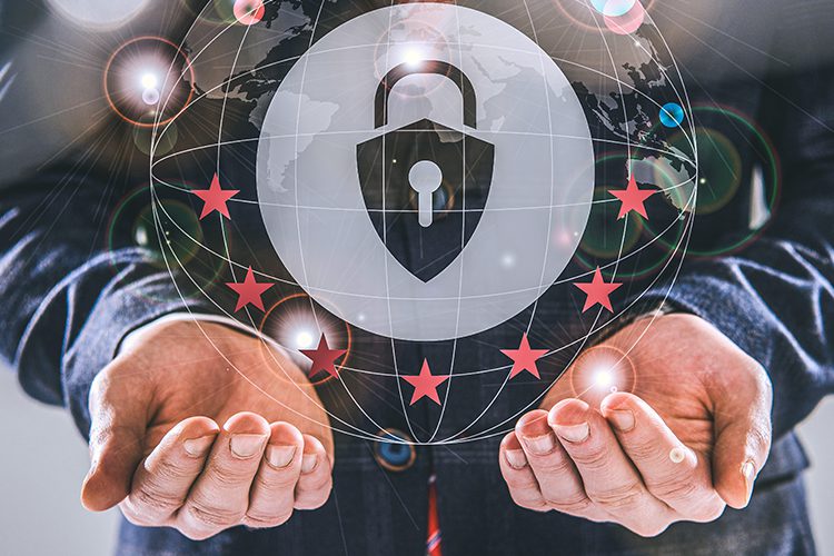 A person holds open hands beneath a digital padlock icon, surrounded by red stars and network lines, symbolizing cybersecurity and data protection.