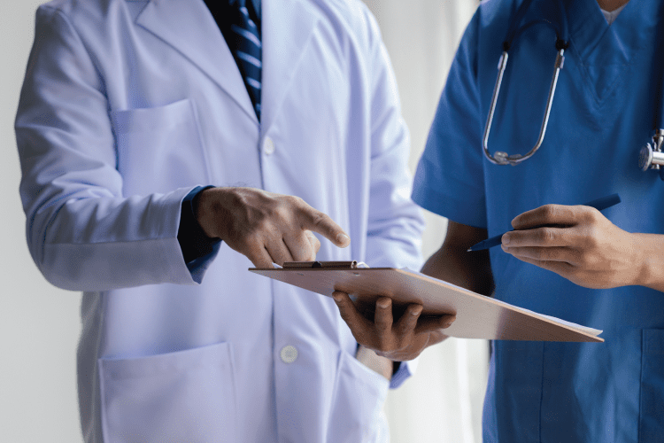 Healthcare professionals reviewing a chart