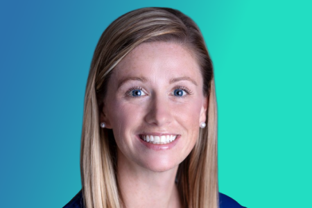 A woman with straight blonde hair, wearing a dark top and pearl earrings, smiles in front of a blue-green gradient background, reflecting the calm assurance you’d expect from an urgent care professional who understands the peak end rule in patient experiences.