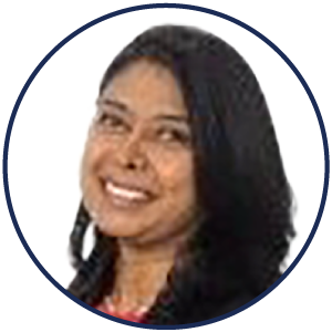 Portrait of a woman with long dark hair, smiling, shown inside a circular frame with a plain white background—conveying warmth and confidence often associated with an exceptional ambient AI patient experience.